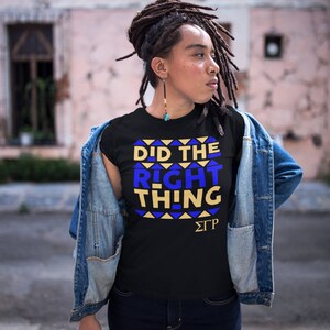 May include: A black t-shirt with a blue and gold graphic that says "Did the Right Thing" and the letters "&Sigma;&Gamma;&Rho;".
