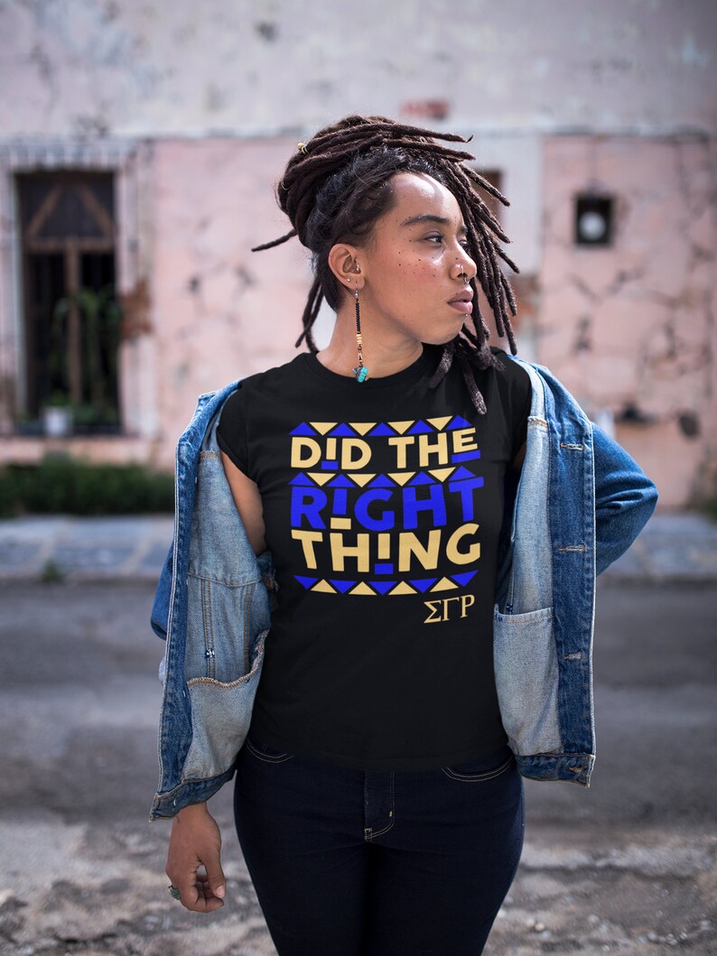 May include: A black t-shirt with a blue and gold graphic that says "Did the Right Thing" and the letters "&Sigma;&Gamma;&Rho;".