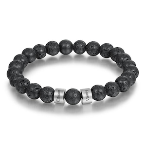 May include: Black lava rock beaded bracelet with two silver bead charms engraved with the names "Edison" and "Valery".