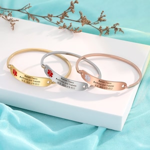 May include: Three medical alert bracelets in gold, silver, and rose gold. Each bracelet has a red medical symbol and the text "Renee Owens Asthma and Diabetes ICE 815-978-8512".