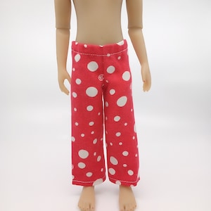 May include: Red pajama pants with white polka dots. The pants have a wide leg and a comfortable fit.