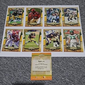 May include: A sheet of eight Humpty's football trading cards featuring various players in action poses. Each card has a gold border and the Humpty's logo. A small card below reads "Thank you" and celebrates the 35th anniversary.