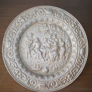 rare antique old Decorative Heavy iron Cast Iron Round shaped  French Plaque - vine drinking scene