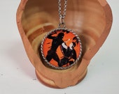Metal pendant necklace and Achilles and Pentesilea image, black figure amphora by the painter Exekias