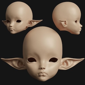 May include: Three beige doll heads with large, pointed ears and blank eye sockets are displayed against a dark background. The heads are in different orientations, showcasing the side and front views of the sculpted features.