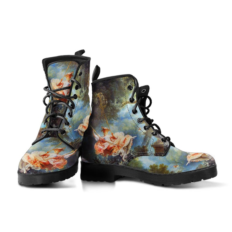 Angled view of boots displaying toe area, print continuity, and overall construction