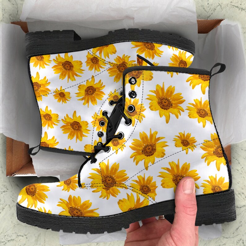 Close-up of sunflower illustration showing petal detail and flower center on leather