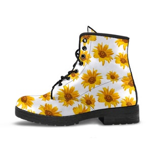 Sunflower motifs arranged across vegan leather boot in bright botanical design
