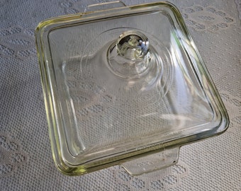 Vintage pyrex casserole dish with lid in clear green, art deco style in good used condition, minor chips and scratches, possibly 50s