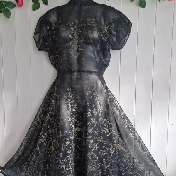 Homemade vintage dress in black and gold foil motif sheer organza fabric, full skirt, high neck dropped shoulder design, unusual dress