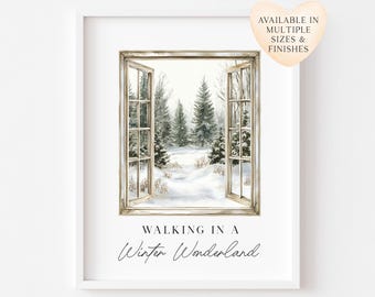 May include: A framed wall art print featuring an open window looking out onto a snowy forest with evergreen trees. The text below the window reads WALKING IN A Winter Wonderland. A heart-shaped graphic in the corner says AVAILABLE IN MULTIPLE SIZES & FINISHES.