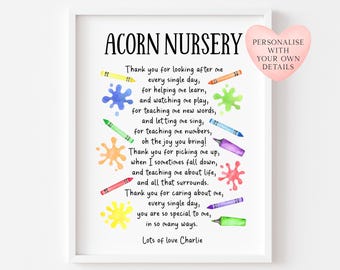 May include: A framed print featuring the words "ACORN NURSERY" and a poem. The poem is decorated with colourful crayon illustrations and paint splatters. A pink heart-shaped sticker says "PERSONALISE WITH YOUR OWN DETAILS."