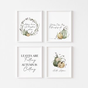 May include: Four framed art prints with autumn-themed watercolor illustrations. Each print features pumpkins and foliage, with phrases like "Autumn leaves and pumpkins please" and "Leaves are falling, autumn is calling."