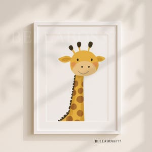 May include: A white framed print featuring a cartoon illustration of a giraffe with a yellow body and brown spots. The giraffe has a friendly smile and is looking directly at the viewer.