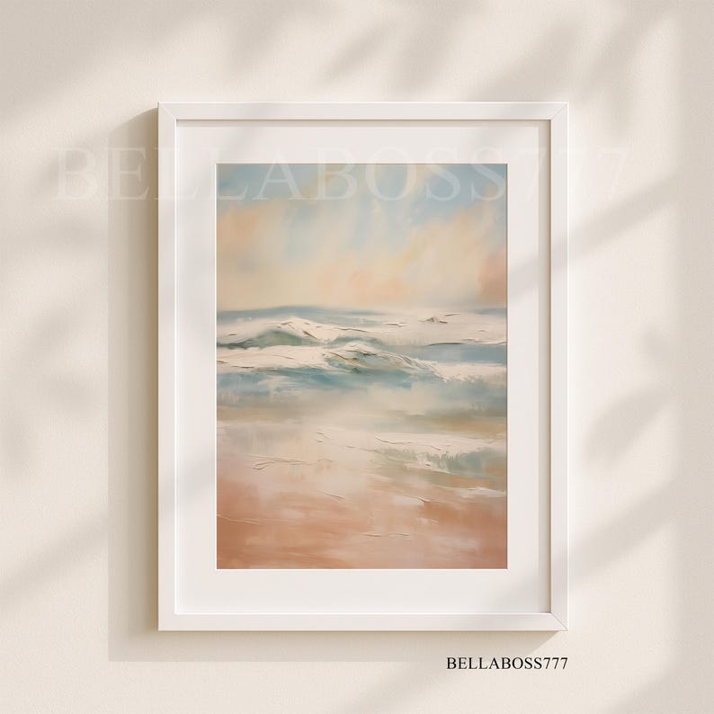 May include: A framed painting of a seascape with soft, pastel colors. The painting depicts a beach with waves crashing on the shore. The sky is a light blue with hints of pink and orange.