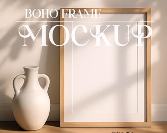 May include: A mockup of a wooden frame with a white background. The frame is sitting on a wooden floor with a white ceramic vase to the left. The text "BOHO FRAME MOCKUP" is written above the frame.