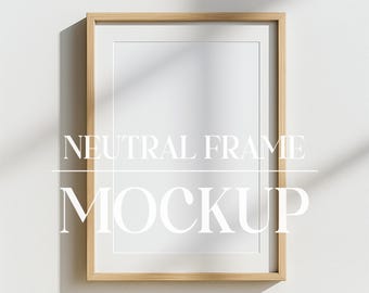 May include: A neutral wood frame mockup with a white background. The frame is on a white wall with shadows from a window. The text "NEUTRAL FRAME MOCKUP" is below the frame.