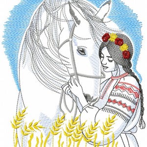 May include: A woman in a traditional embroidered dress with a floral crown is holding a white horse's head. The horse has a bridle on and is looking at the woman. The background is a blue sky with white clouds and yellow wheat stalks.