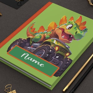 Diario de tapa dura con diseño de dinosaurio personalizado en Monster Trucks, con acabado mate, 150 páginas con renglones anchos y rayas, 5,75" x 8"