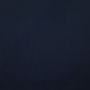 May include: A solid navy blue fabric with a subtle textured appearance. The material has a slightly uneven surface, creating a visual depth. The color is consistent throughout the image, with no visible patterns or designs.