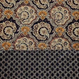 May include: A fabric swatch with a paisley pattern in shades of brown, gold, and black. The fabric has a smooth, velvety texture. The bottom half of the swatch features a geometric pattern in black and gold.