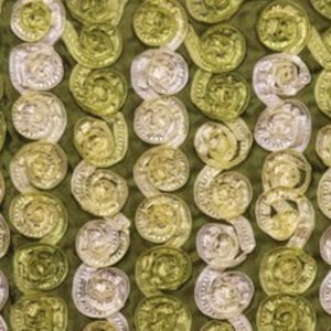 May include: A close-up of a fabric with a repeating pattern of gold and silver circles. The circles are arranged in vertical rows and are slightly raised from the fabric.