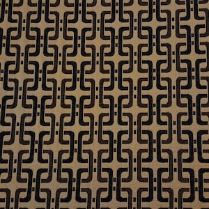 May include: A brown and black geometric pattern fabric with a repeating design of interlocking squares.
