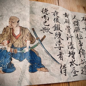 May include: An antique Japanese woodblock print depicting a samurai warrior in a dynamic pose, holding a katana. The print features detailed calligraphy and vibrant colors, showcasing traditional attire and weaponry.