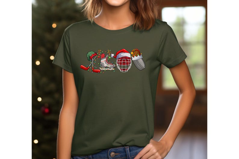 May include: A green t-shirt with a Christmas-themed hockey design. The design features a hockey stick, skates, a hockey helmet, and a Santa hat.