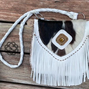 cowhide white leather purse with tiger's eye rock and fringe.