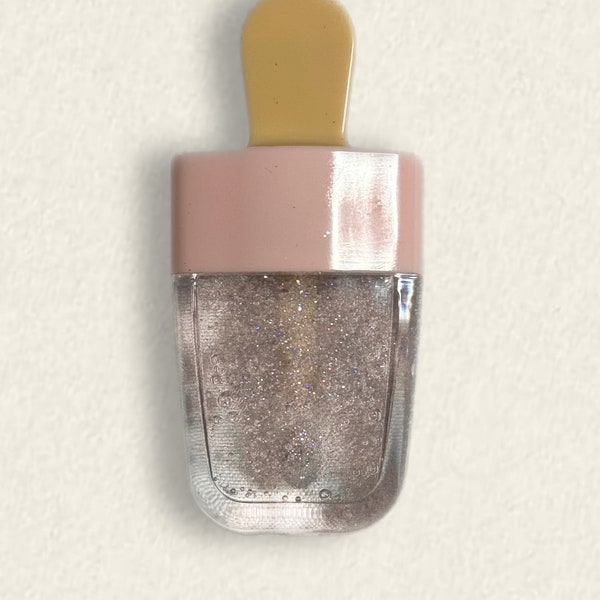 Glitter clear lip gloss in a decorative ice cream tube. Added Vitamin E and Jojoba & Coconut oil.