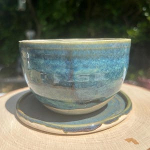 Ceramic plant holder with seperate dish to collect any excess water