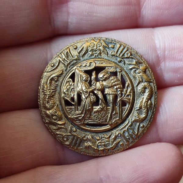 Antique cutwork gilt brass picture button.