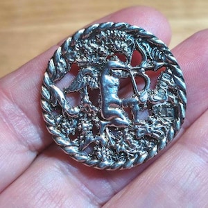 1897 silver cherub button