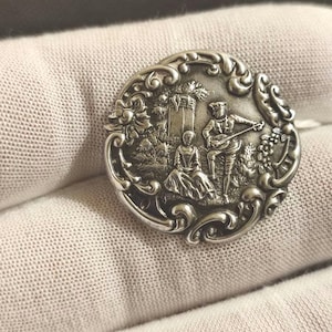 Antique silver lovers button