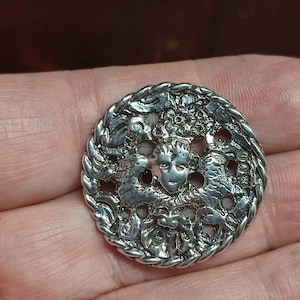 Antique silver cherub button