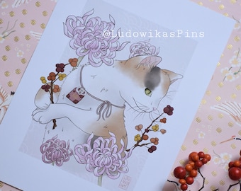 May include: A white and brown cat with green eyes sits among pink chrysanthemums and brown branches with small orange berries. The cat is wearing a red and gold charm around its neck. The image is titled "LudowikasPins".