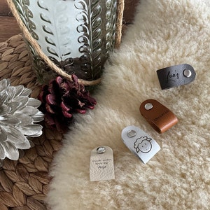 May include: A handmade wooden sign with the text "Welcome" in a playful font. The sign features a distressed finish and a simple, rustic design, perfect for a front door or entryway. The sign is approximately 12 inches wide.
