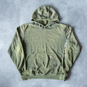May include: A green hooded sweatshirt with a large pocket on the front and the word "Carhartt" printed on the left sleeve.