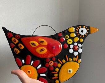 Fused glass bird wall hanging , reds yellows and orange details with little mille fiori and sparkling dichro details. Stunning wall art