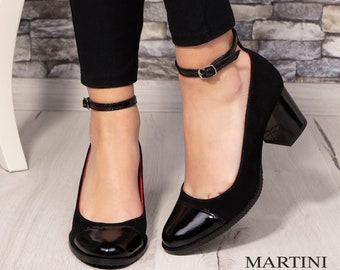 May include: Black ankle strap heels with a black patent leather toe cap. The heels are about 3 inches high.