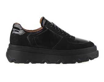 May include: Black leather and suede low-top sneakers with a chunky platform sole.