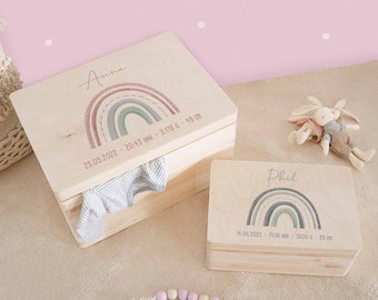 May include: Two wooden keepsake boxes with rainbow designs and personalized names, "Anna" and "Phil". Each box includes birth details, such as date, time, weight, and length. The boxes are perfect for storing baby mementos.
