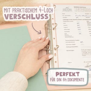 May include: A light pink binder with a metal four-ring mechanism holding a white A4 document. The text on the image reads MIT PRAKTISCHEM 4-LOCH VERSCHLUSS and PERFEKT F&Uuml;R DIN A4 DOKUMENTE. A light green sheet is visible on the left side of the binder.