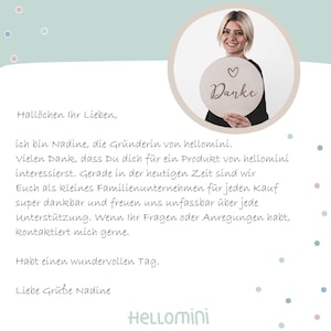 May include: A circular wooden sign featuring the word Danke and a small heart icon, held by a person. The image includes a message in German starting with Hall&ouml;chen Ihr Lieben, followed by text about the brand hellomini and a closing signature.