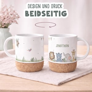 May include: White ceramic mug with a cork base, featuring jungle animal illustrations and the name "Jonathan". The mug has a handle and is decorated with a monkey, bird, and other jungle elements. The text "DESIGN UND DRUCK BEIDSEITIG" is at the top.