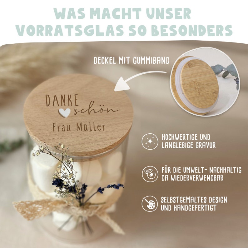 May include: A clear glass jar with a wooden lid that says "DANKE sch&ouml;n Frau M&uuml;ller" and a heart. The jar is filled with white marshmallows and decorated with a small bouquet of dried flowers and a piece of lace. The jar is a sustainable and reusable gift idea.