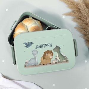 Eine bunt bedruckte Mepal Lunchbox mit niedlichem Dinosaurier Motiv