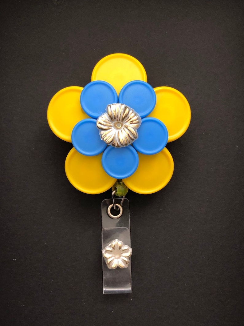 Rebecca 10 petal Yellow and Blue Flower with Gold Flower Cabachon Med Cap Vial Badge Reel