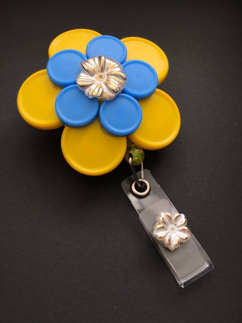 Rebecca 10 petal Yellow and Blue Flower with Gold Flower Cabachon Med Cap Vial Badge Reel
